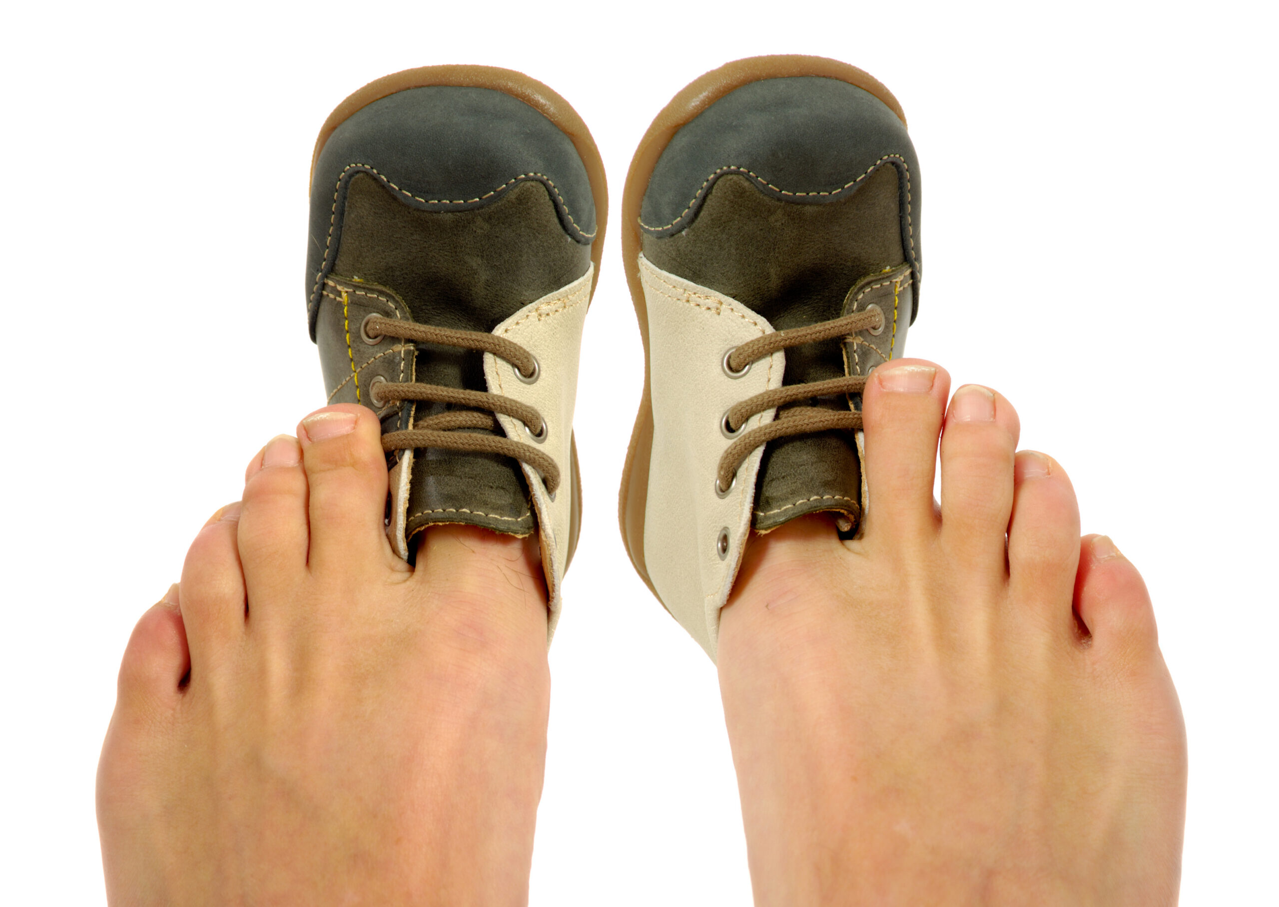 Person trying to fit toes in tiny shoe. Tight fitting shoe concept